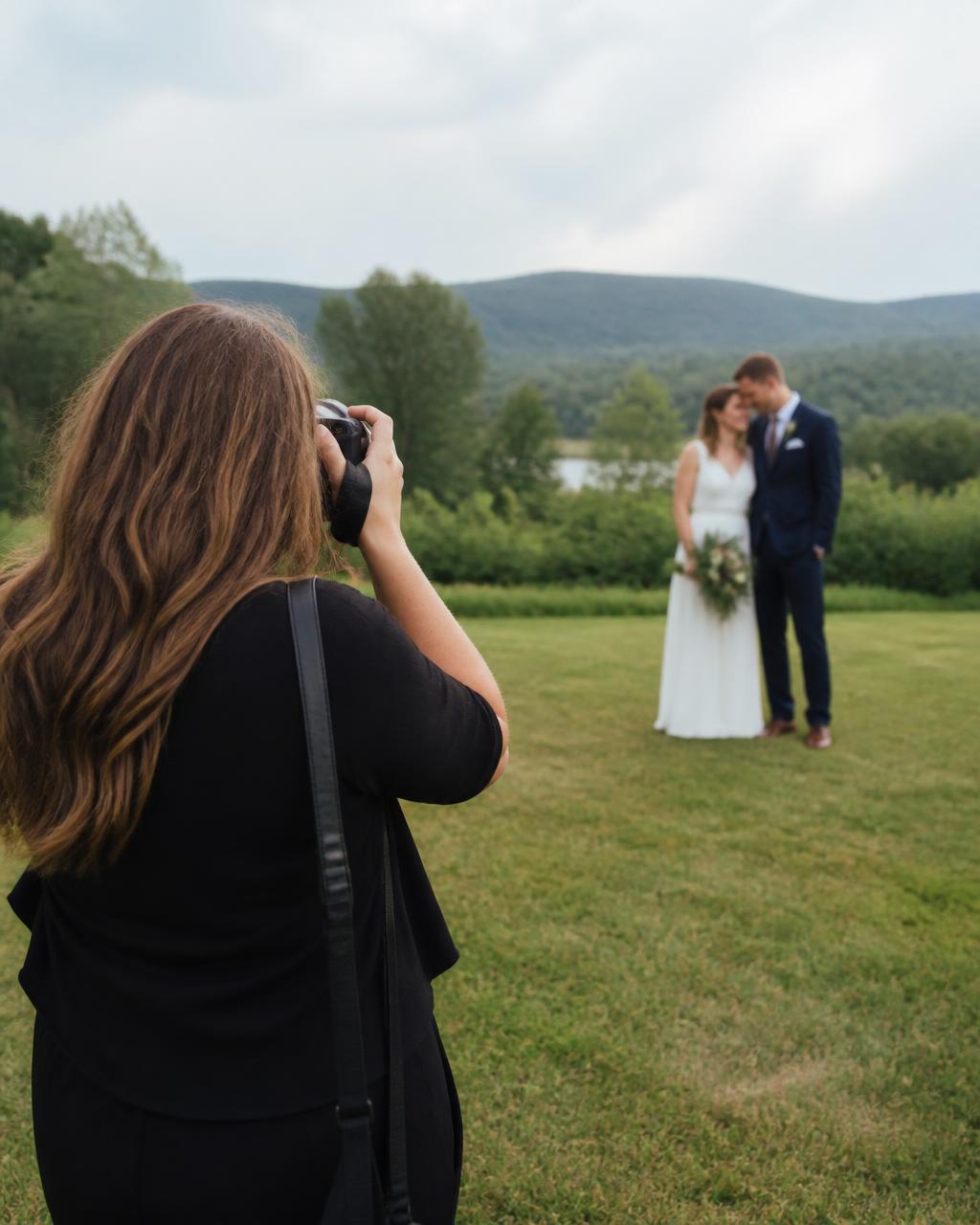 Event photographer capturing a wedding couple outdoors
